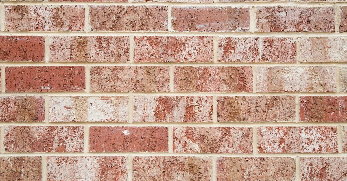 Close-up of a red and white brick wall pattern for design or background use.