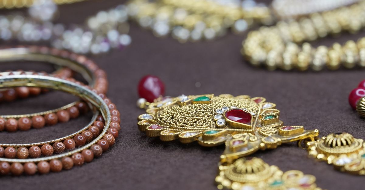 Stunning close-up of intricately designed gold and beaded jewelry showcasing traditional craftsmanship.