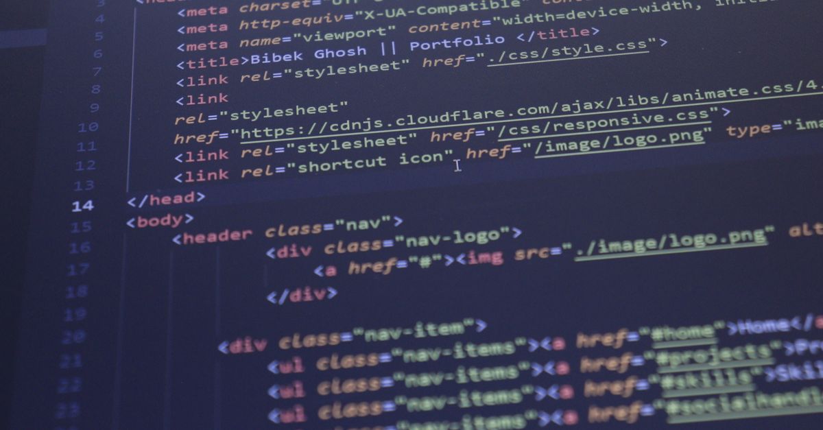 Close-up view of HTML and CSS code displayed on a computer screen, ideal for programming and technology themes.