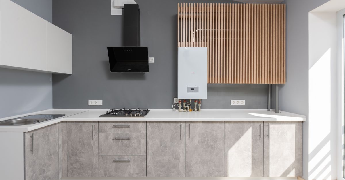 Bright modern kitchen interior design with appliances and cabinetry.
