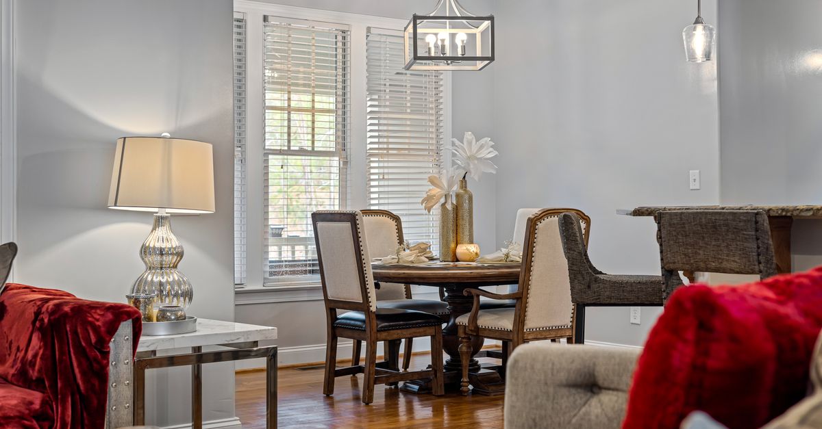A stylish and cozy living room interior featuring a modern furniture setup and soft lighting.