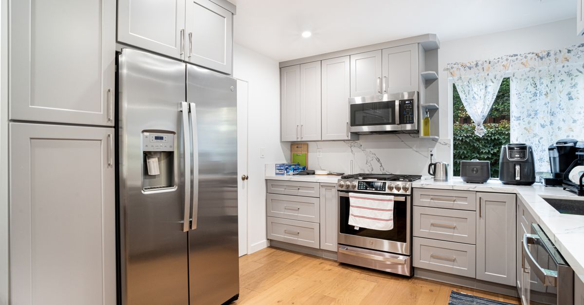 Contemporary kitchen interior featuring stainless steel appliances and sleek cabinetry.