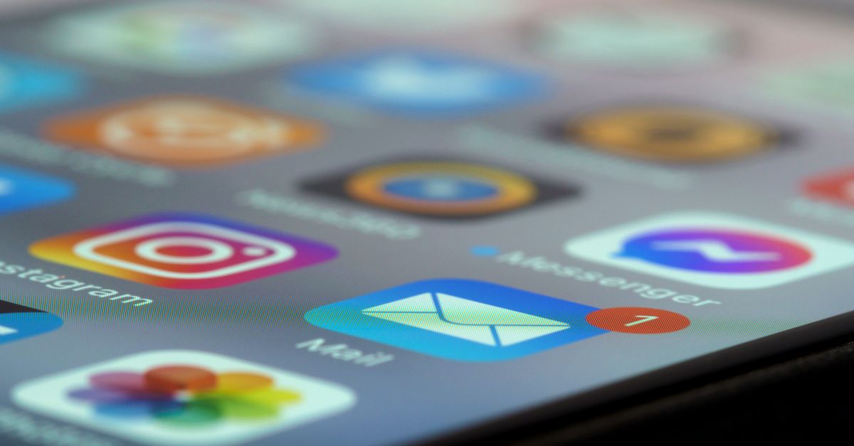 Detailed close-up of smartphone screen displaying various app icons and notifications.