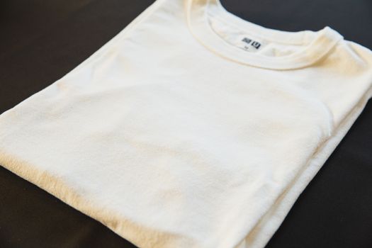 High angle of classic new male t shirt with tag and round shaped neckline