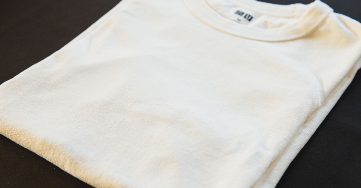 High angle of classic new male t shirt with tag and round shaped neckline