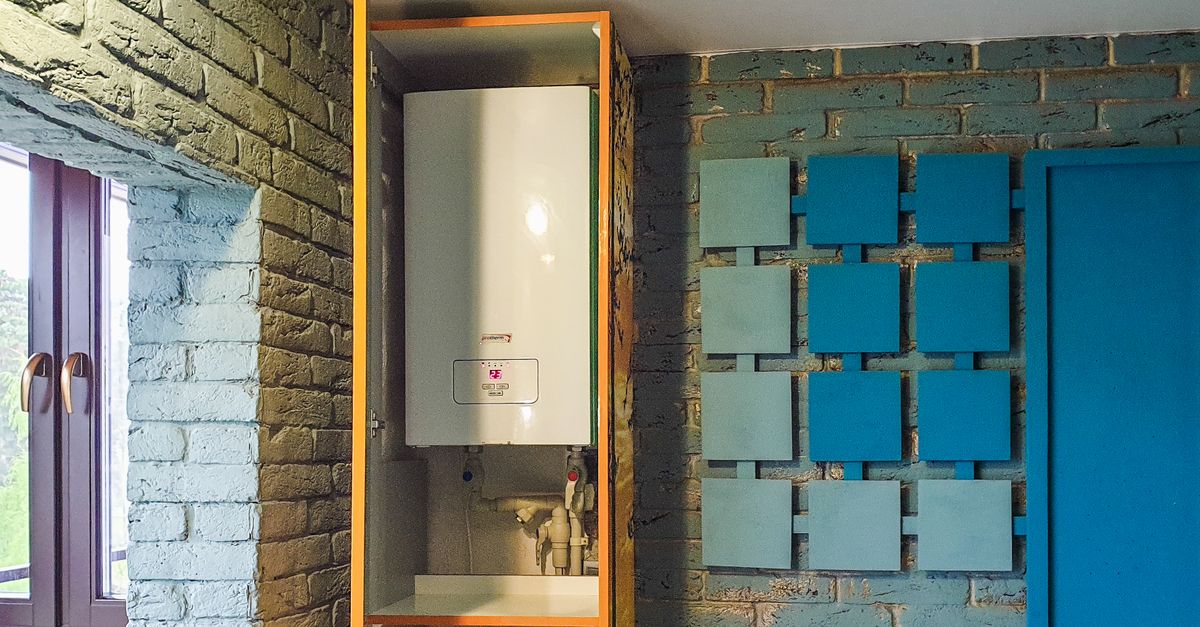 Indoor view of a water heater neatly installed in a cabinet with modern decor.
