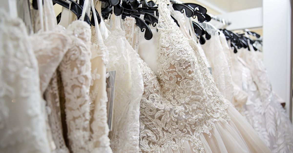 Beautiful lace wedding dresses on display in a bridal boutique, showcasing intricate designs and elegance.